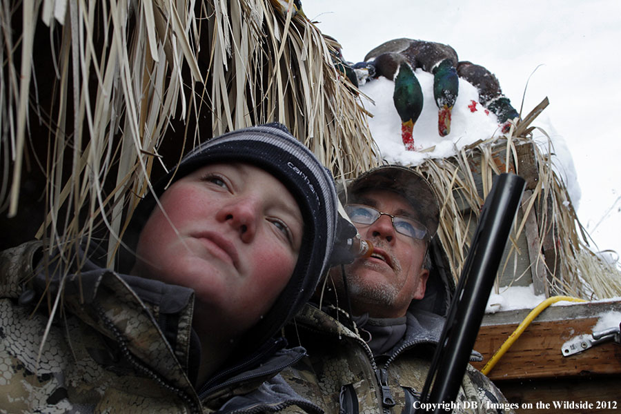 Father and son hunting waterfowl.