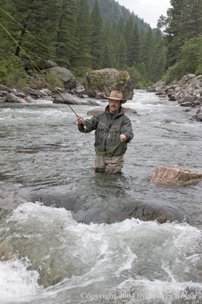 Flyfisherman pocket fishing on stream.