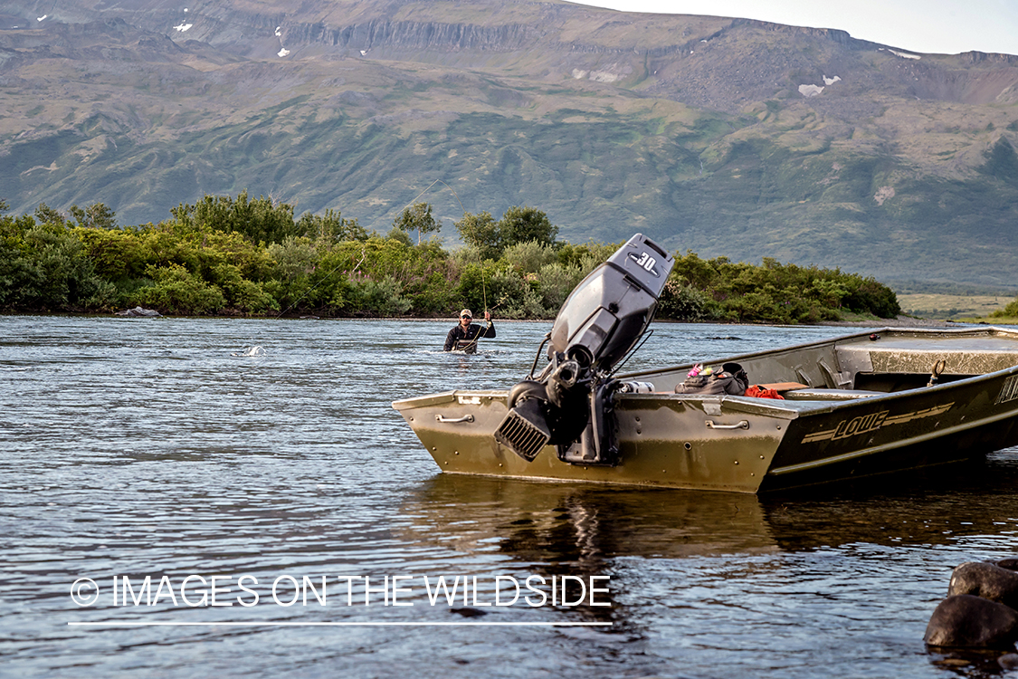 Flyfisherman in water, Alaska.