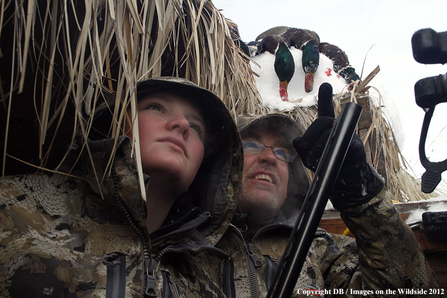 Father and son hunting waterfowl.