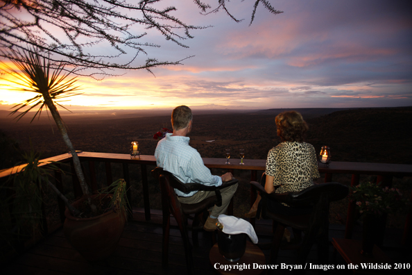 Couple watching sunset on safari