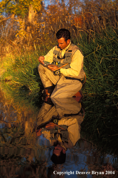 Flyfisherman choosing flies.