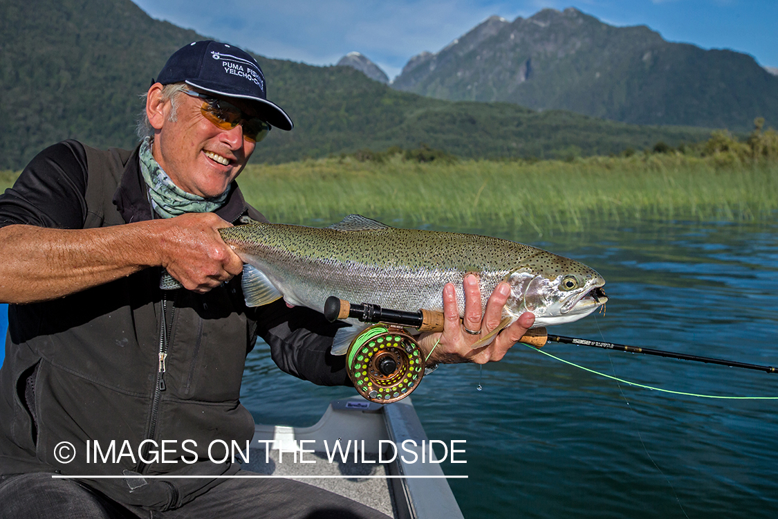 Flyfisherman with rainbow trout.