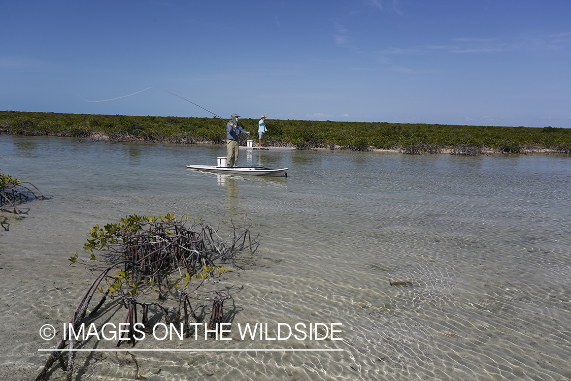 Saltwater flyfishermen on stand up paddle boards.