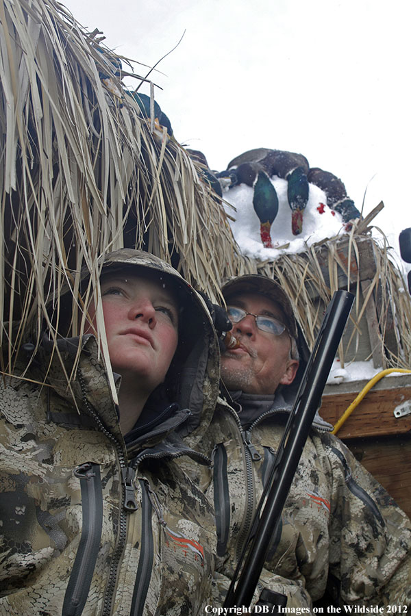 Father and son hunting waterfowl.