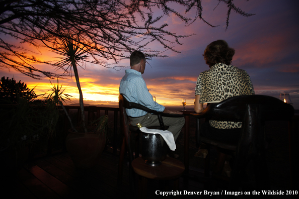 Couple watching sunset on safari