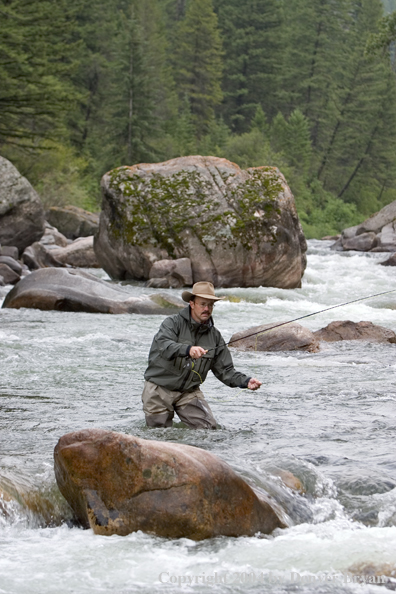 Flyfisherman pocket fishing on stream.