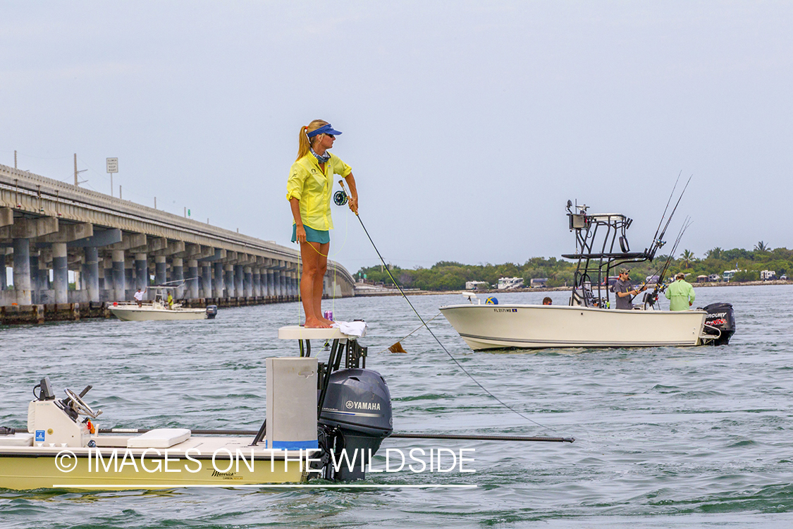 Flyfisherman casting off boat.