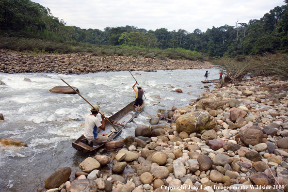 Bolivian Natives canoing down river