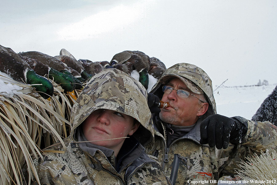 Father and son hunting waterfowl.