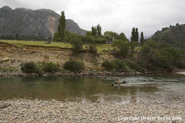 Flyfishermen casting on river.