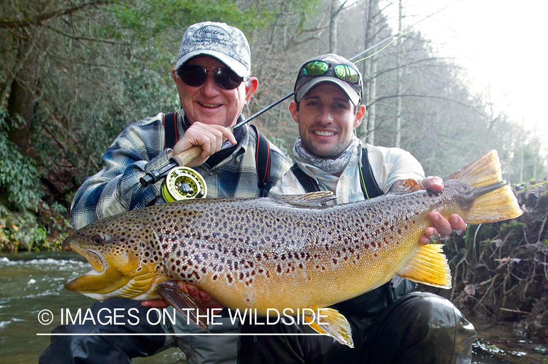 Flyfisherman with brown trout.