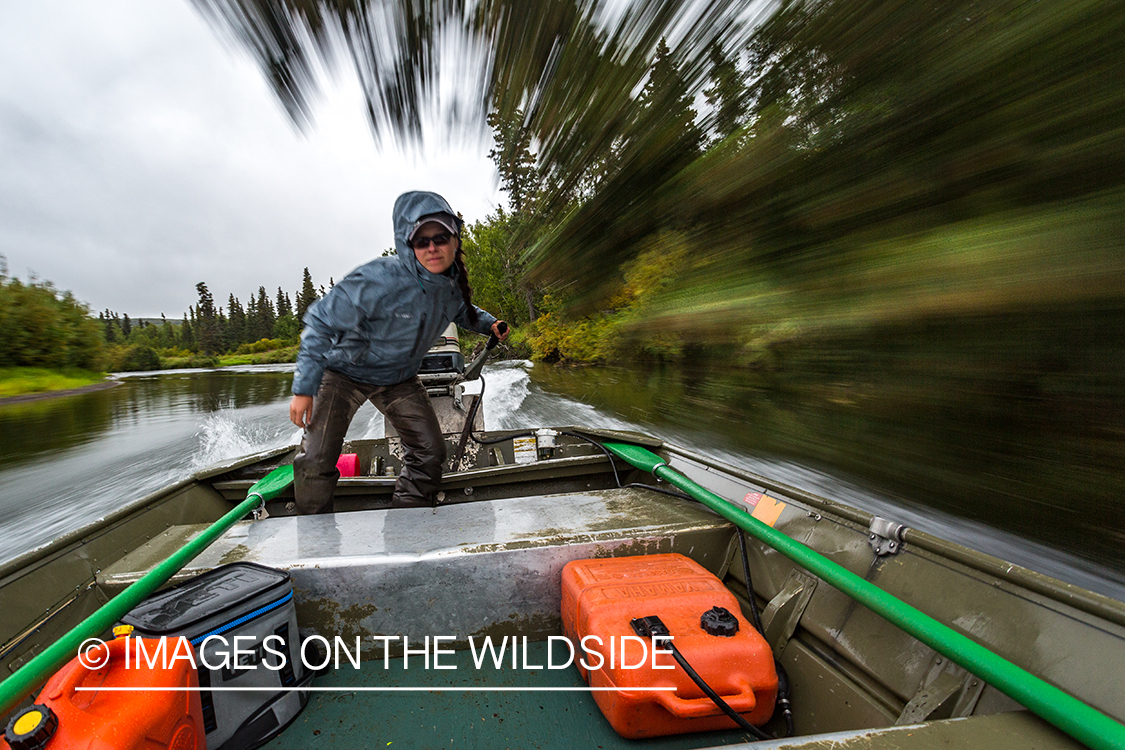 Flyfishing guide Camille Egdorf driving jetboat.