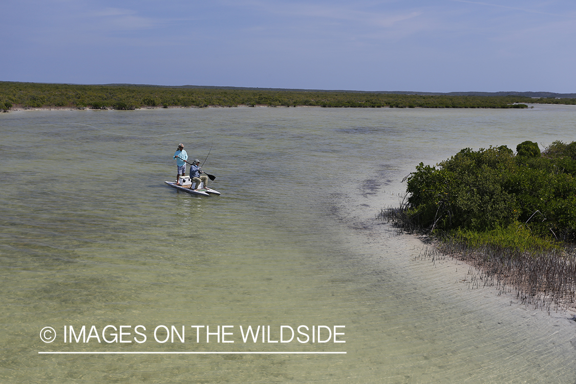 Saltwater flyfishermen on stand up paddle boards.