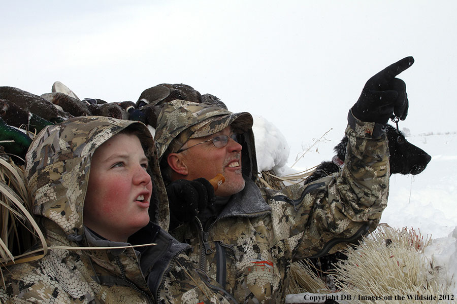 Father and son hunting waterfowl.