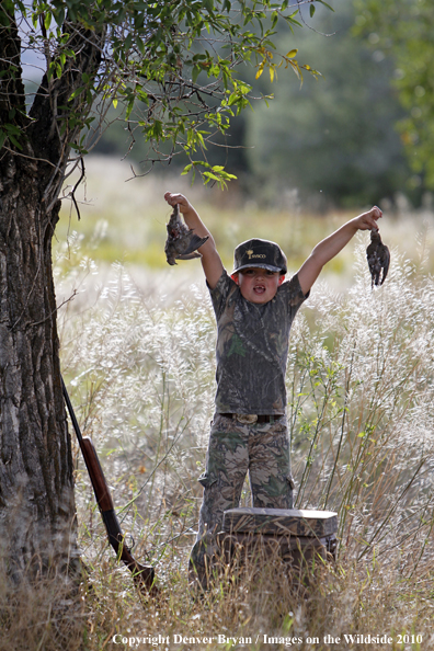 Young Dove Hunter with bagged Doves