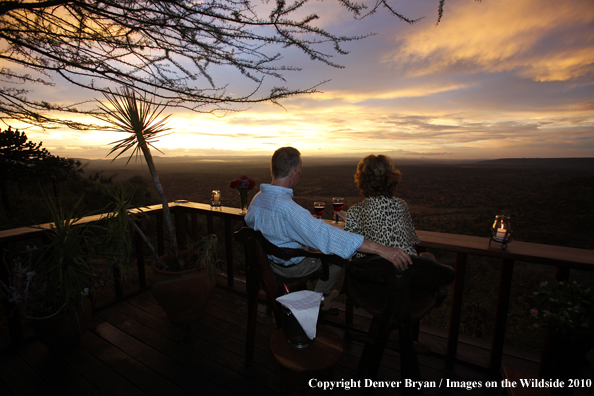 Couple watching sunset on safari