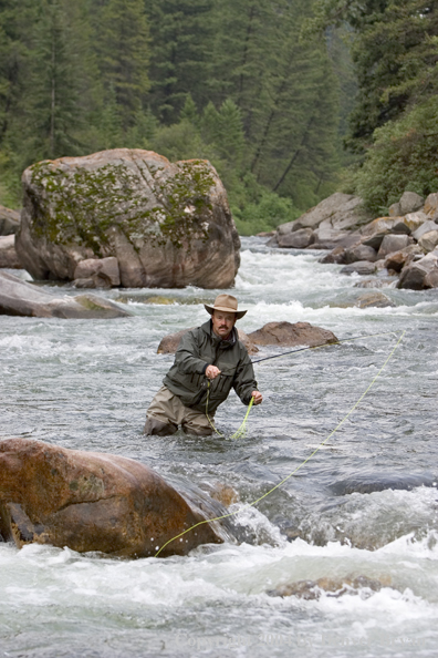 Flyfisherman pocket fishing on stream.