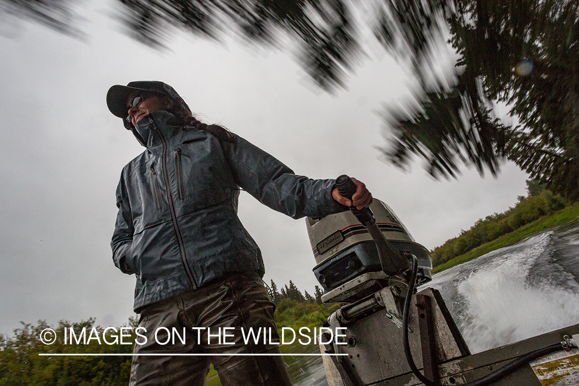 Flyfishing guide Camille Egdorf driving jetboat.