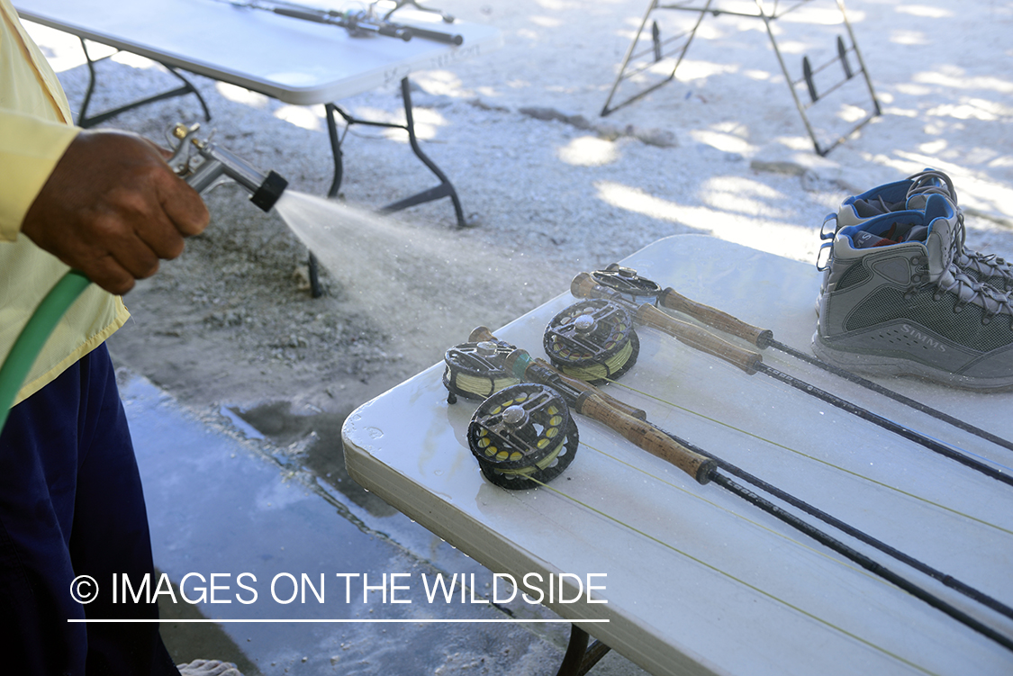 Flyfisherman rinsing off fly rods.