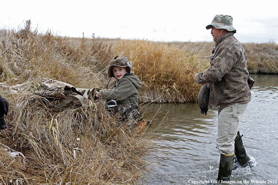 Father and son hunting waterfowl.