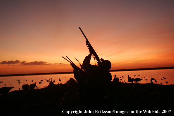 Waterfowl hunters at sunset