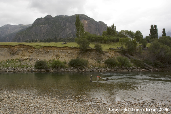 Flyfishermen casting on river.