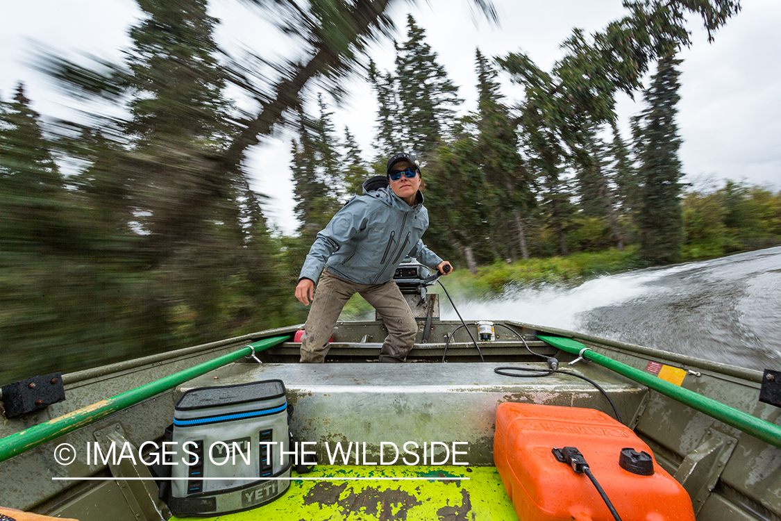 Flyfishing guide Camille Egdorf driving jetboat.