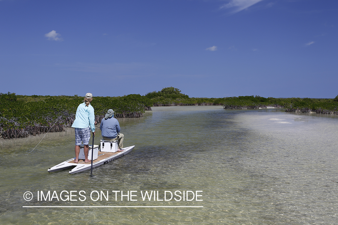 Saltwater flyfishermen on stand up paddle boards.