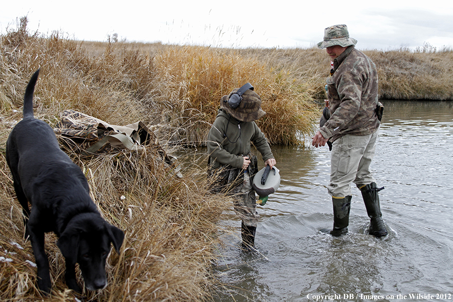 Father and son hunting waterfowl.