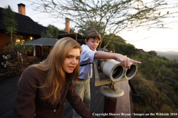 Family watching wildlife on african safari