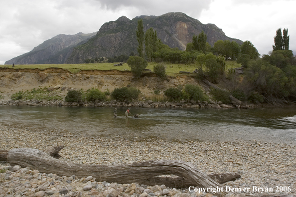 Flyfishermen casting on river.