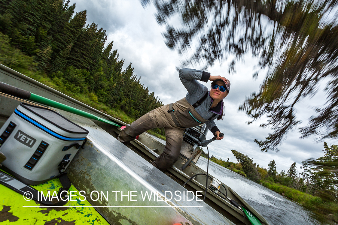 Flyfishing guide Camille Egdorf driving jetboat.