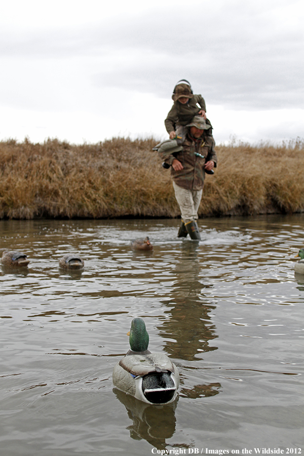 Father and son hunting waterfowl.