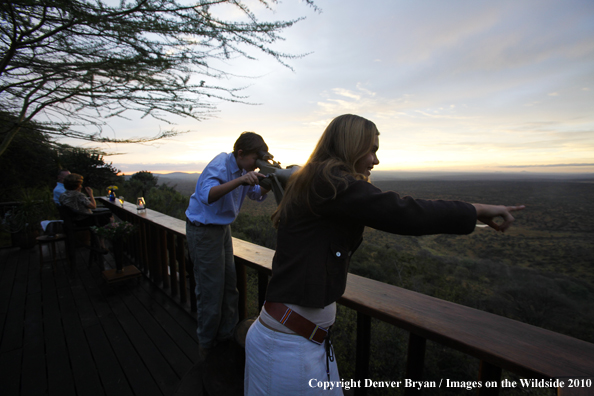 Family watching wildlife on african safari