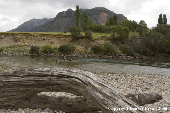 Flyfishermen casting on river.