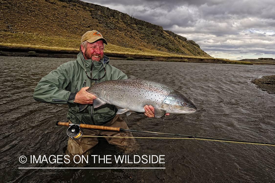 Flyfisherman with sea-run brown trout.