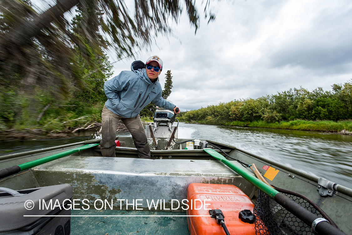 Flyfishing guide Camille Egdorf driving jetboat.