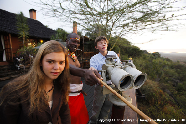 Family watching wildlife on african safari