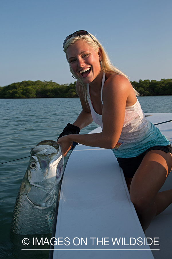 Saltwater fly fisherwoman with tarpon.