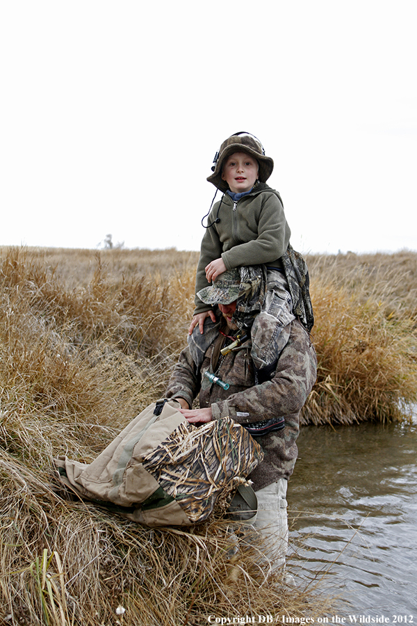 Father and son hunting waterfowl.