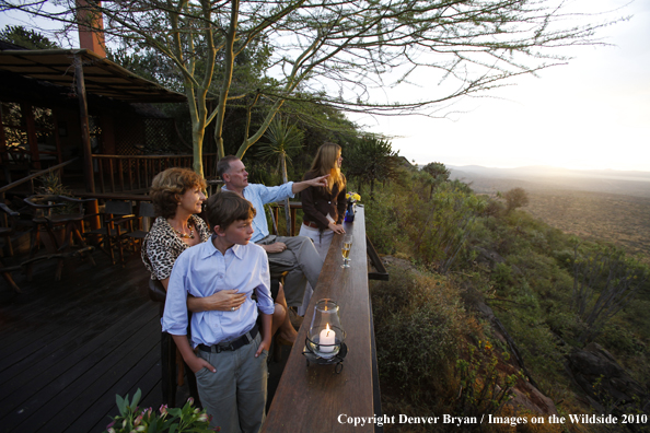 Family watching wildlife on african safari