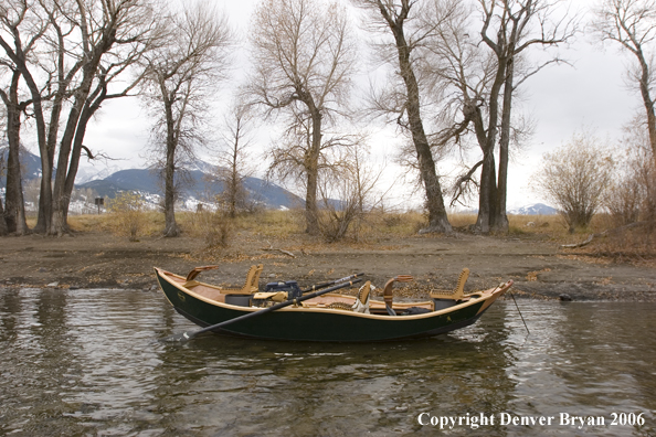 Drift boat on river.