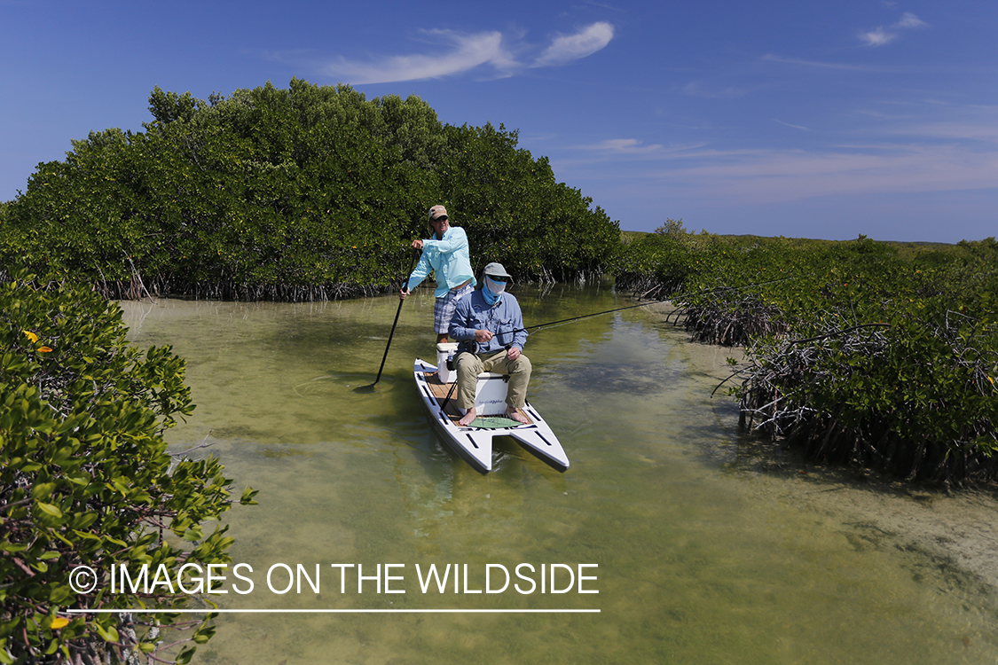 Saltwater flyfishermen on stand up paddle boards.