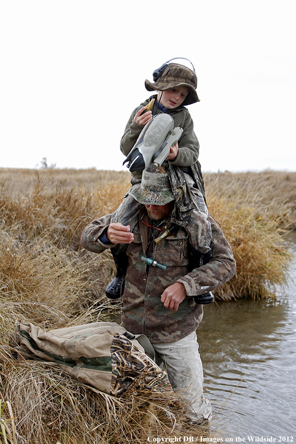 Father and son hunting waterfowl.