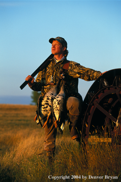 Waterfowl hunter with bagged White-fronted geese.