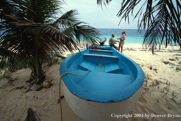 Saltwater flyfishing couple checking gear.