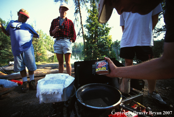 Campers cooking spam.