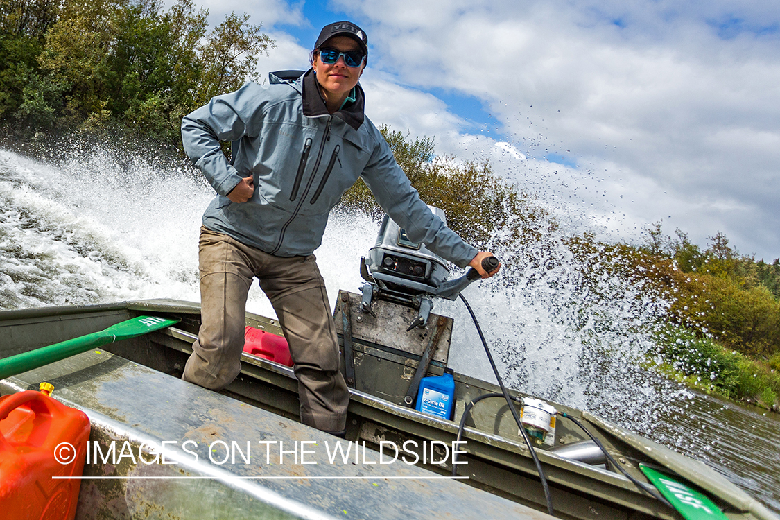 Flyfishing guide Camille Egdorf driving jetboat.