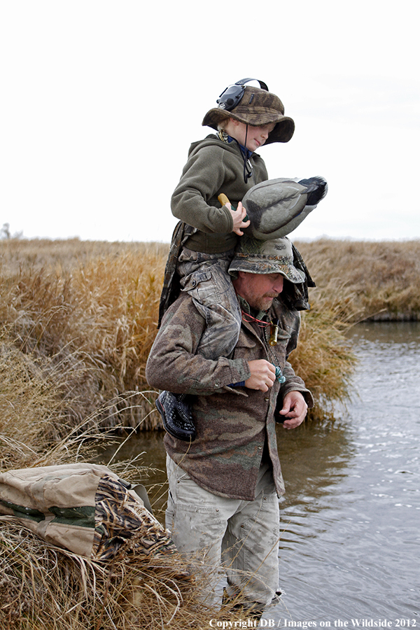 Father and son hunting waterfowl.